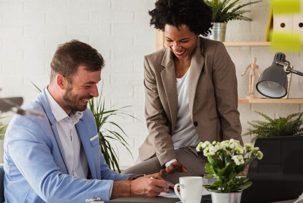 Contact - Business People Discussing Work in Their Creative Office